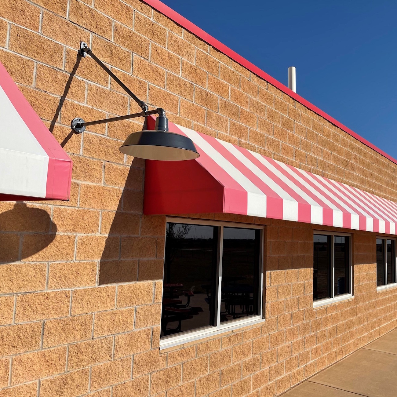 The Original™ Warehouse Gooseneck Light | Photo Courtesy of Stars & Stripes Drive-In Theatre